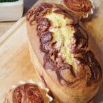 a photo of one loaf of strawberry cream cheese cake on wooden tray.