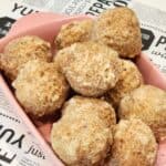 A few bakso goreng on a pink tray.