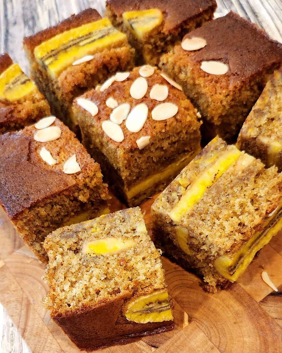 A few sliced Super Moist Banana Bread on a wooden tray.