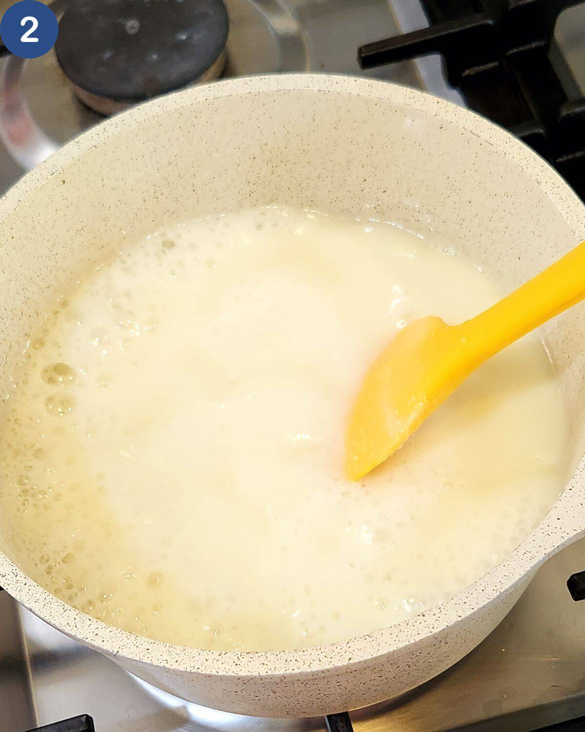 A photo of all ingredients cooked with medium heat and a yellow spatula.