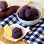 Ube Halaya in a white bowl on blue and white plaid cloth.