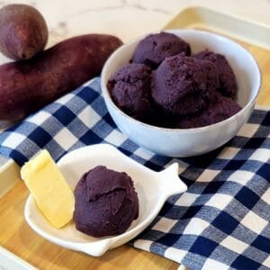 Ube Halaya in a white bowl on blue and white plaid cloth.