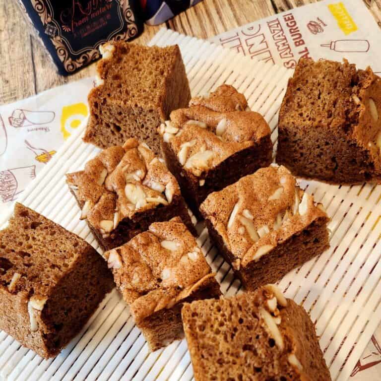 A few slices of Ontbijtkoek cake on a white tray.