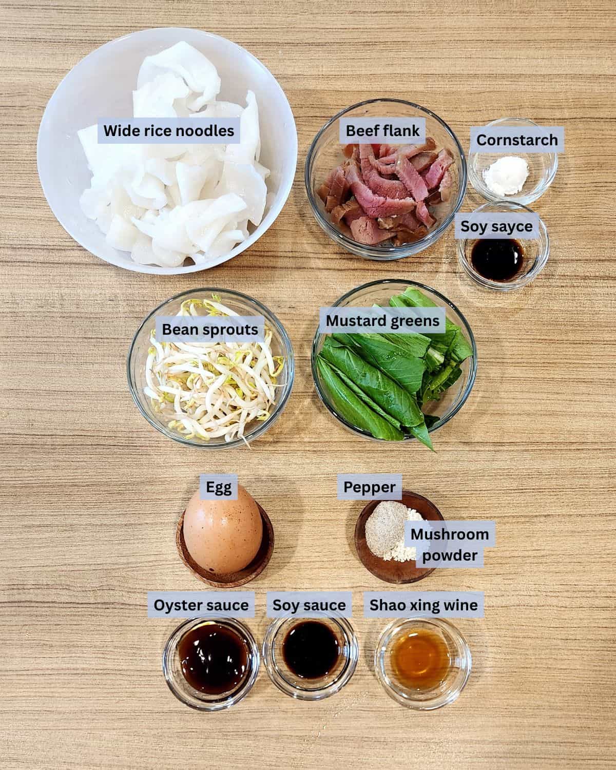 Beef chow fun or kwetiau goreng ingredients with labels.