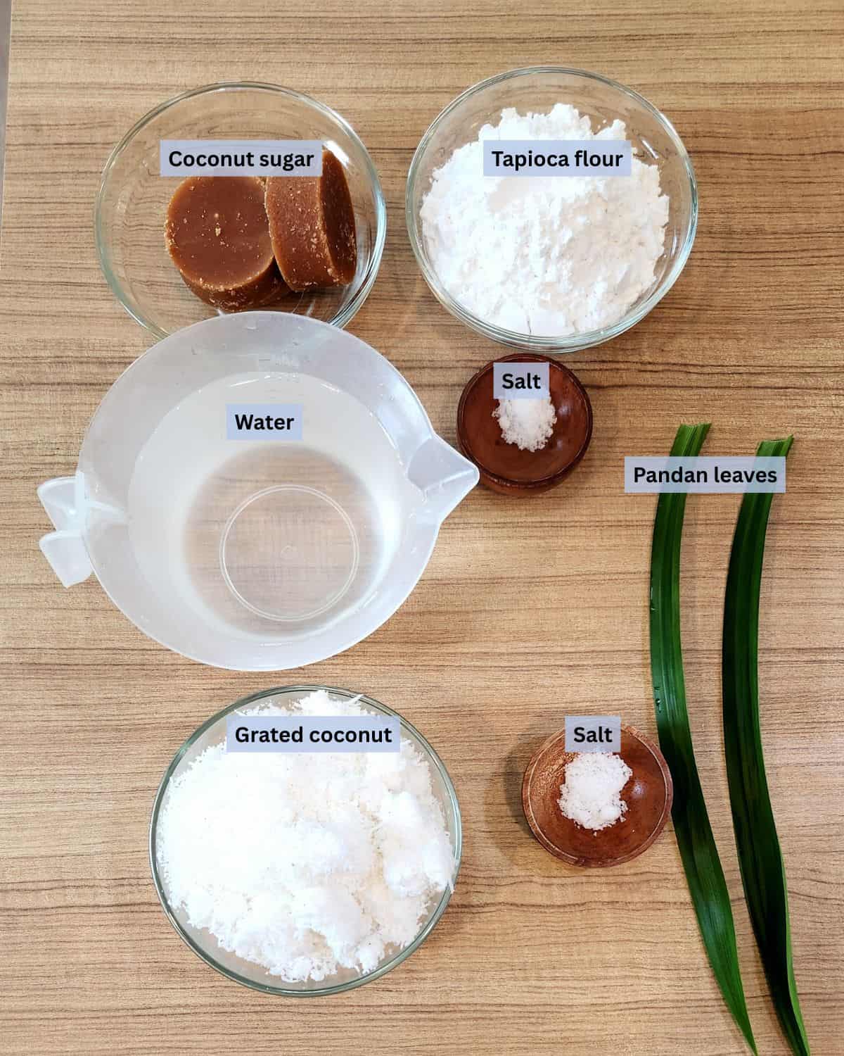 Ongol ongol ingredients with labels on a wooden table.