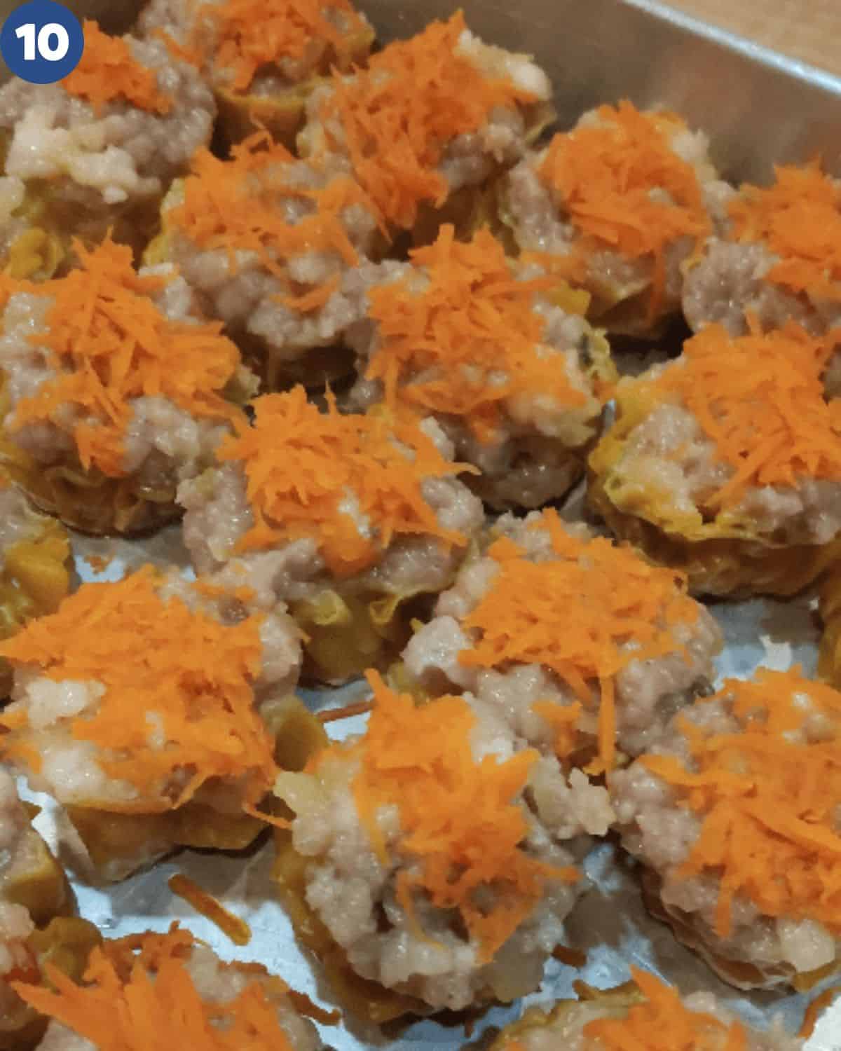 A tray of siu mai after being steamed.
