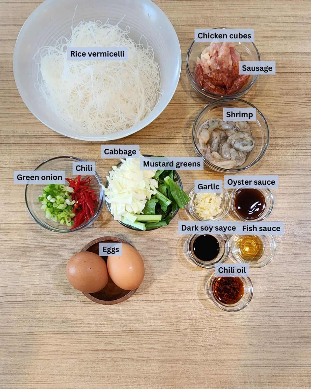 Shrimp chow mei fun or bihun goreng or stir fried vermicelli ingredients with labels.