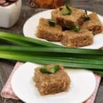 Coconut sugar wajik or palm sugar wajik on a plate with pandan leaves.