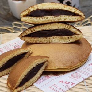A stack of sliced Japanese Dorayaki on parchment paper.