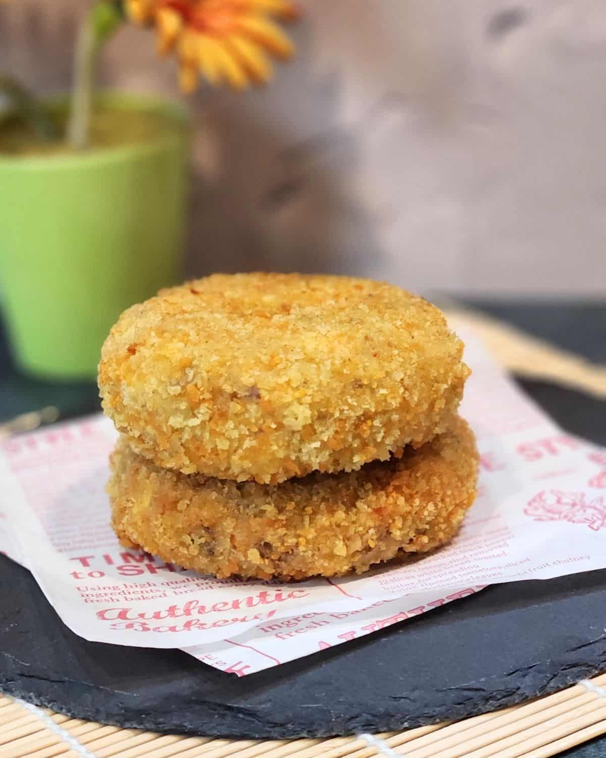 A stack of Japanese croquettes on parchment paper. 