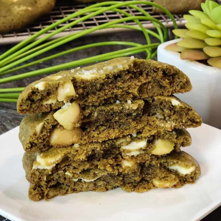 A stack of Matcha Chocolate Chip Cookies on a white plate.