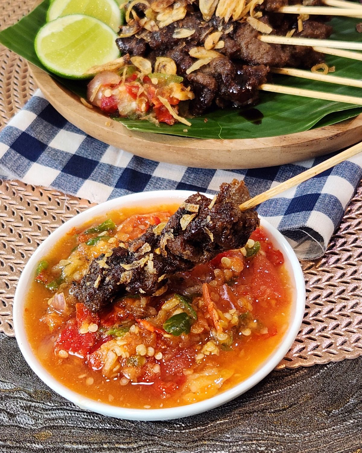 Beef satay sate maranggi dipped into chili sambal.
