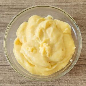 A bowl of creamy custard filling.