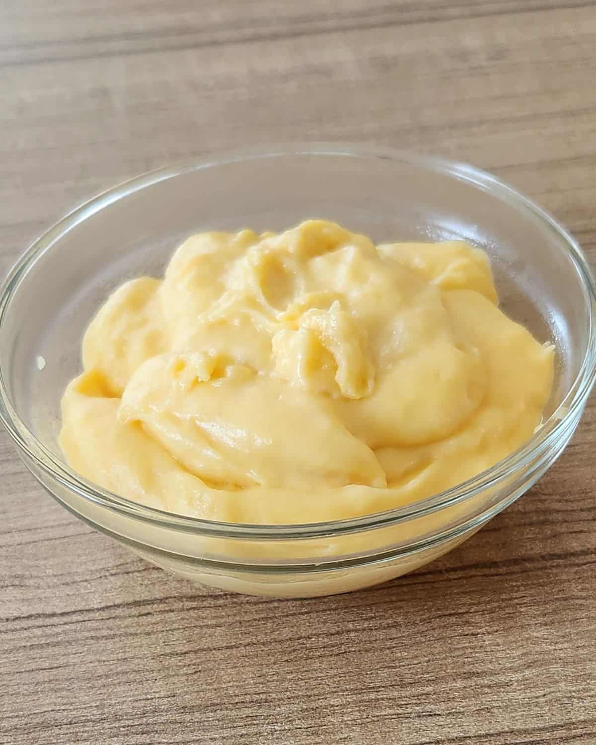 A bowl of creamy custard filling.