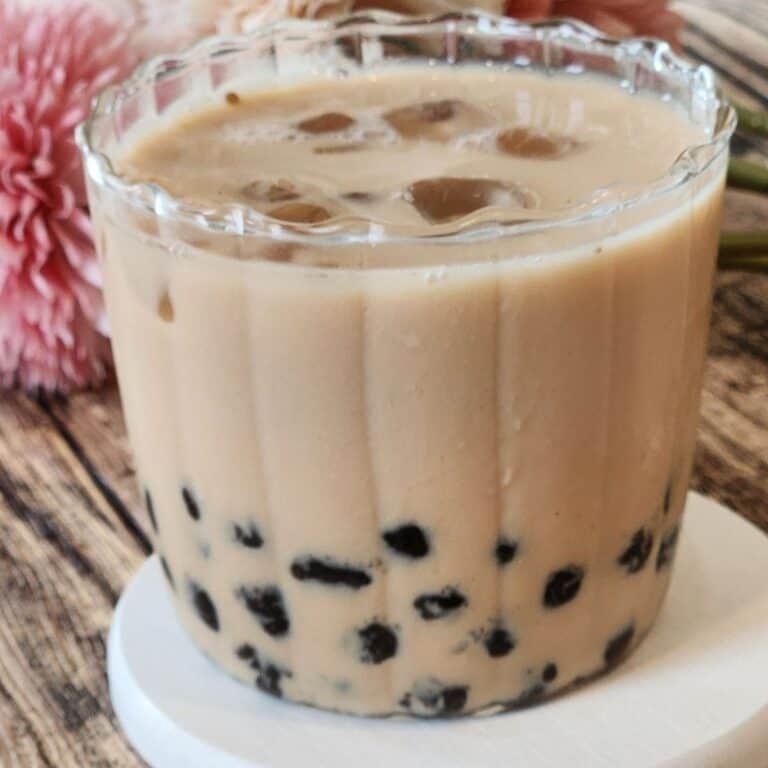 A glass of Earl Grey Milk Tea (London Fog) with tapioca pearls.