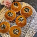 Six Japanese red bean bread on a wire rack.