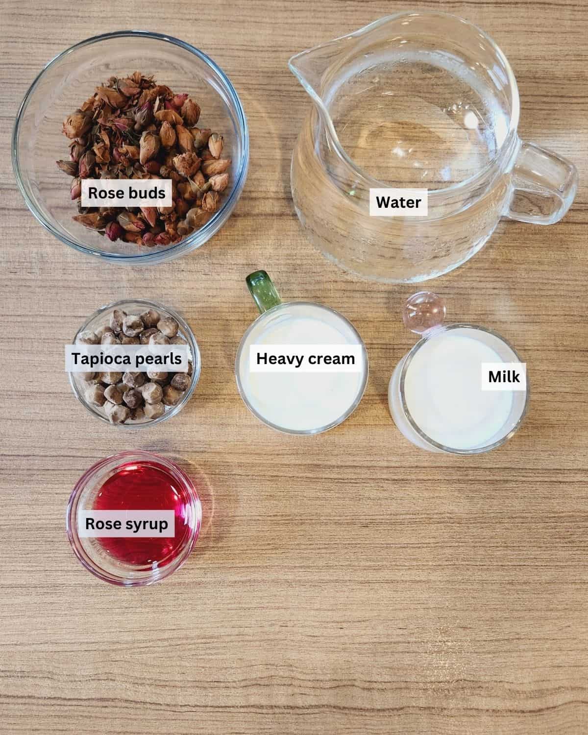 Rose milk tea ingredients with labels.
