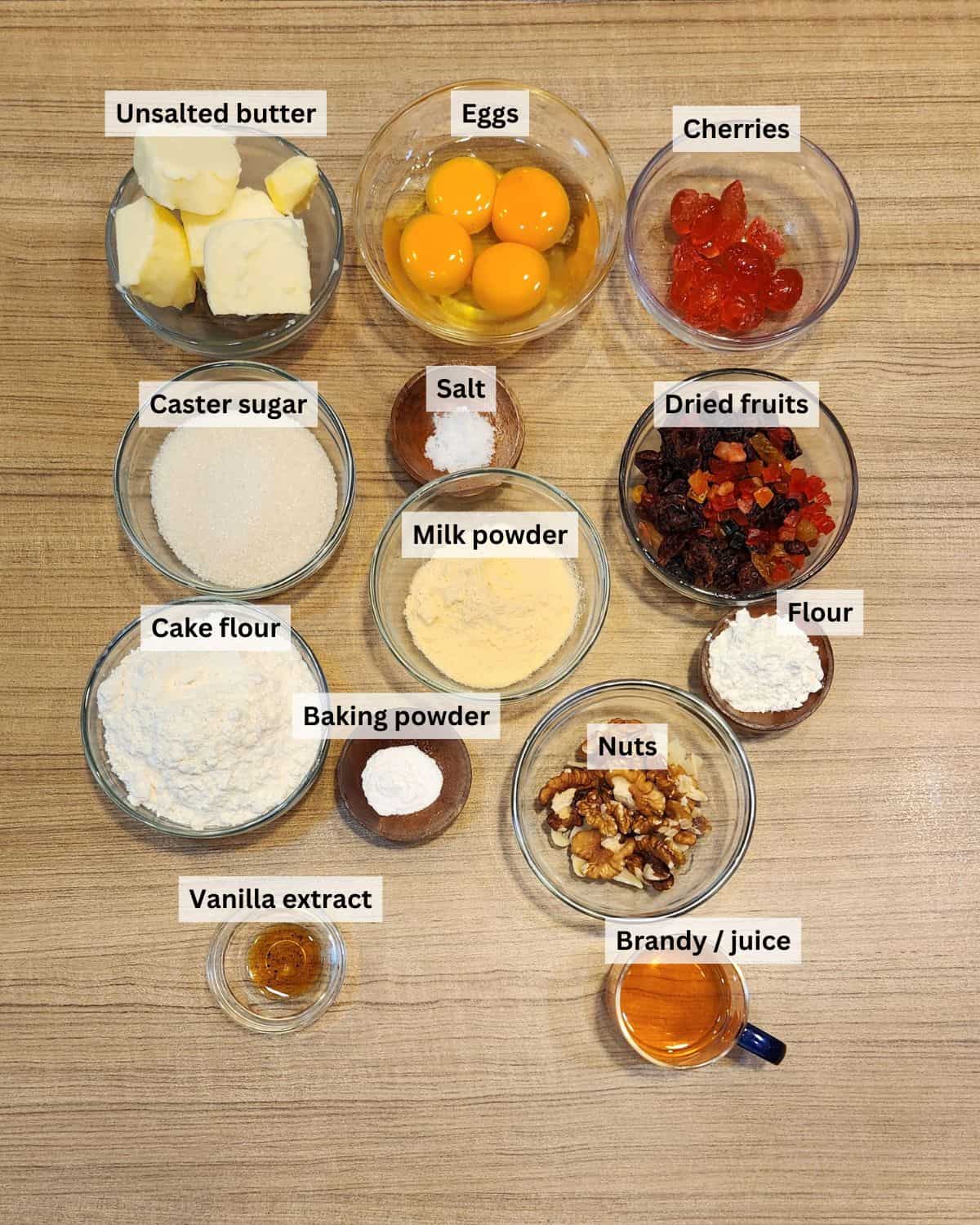 Vanilla fruit cake ingredients with labels.