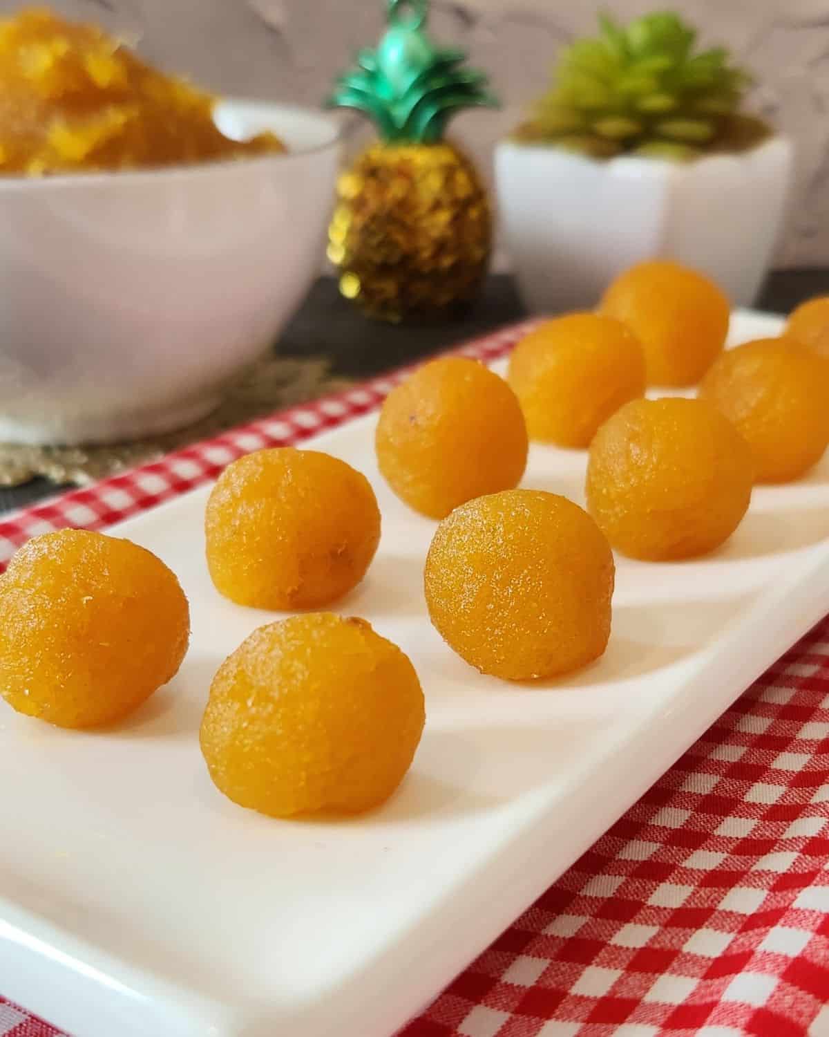 Rounded pineapple cake filling lined up ready for cake filling.
