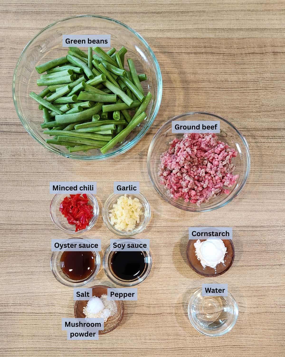 Green beans and ground beef ingredients with labels.