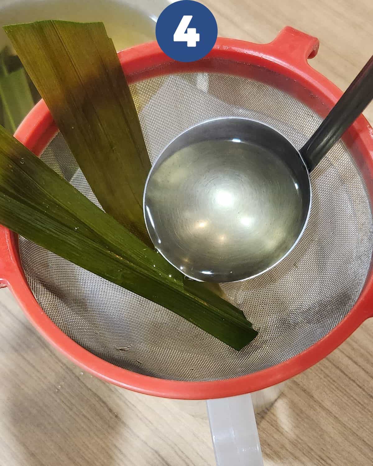 Straining the lemongrass tea process.