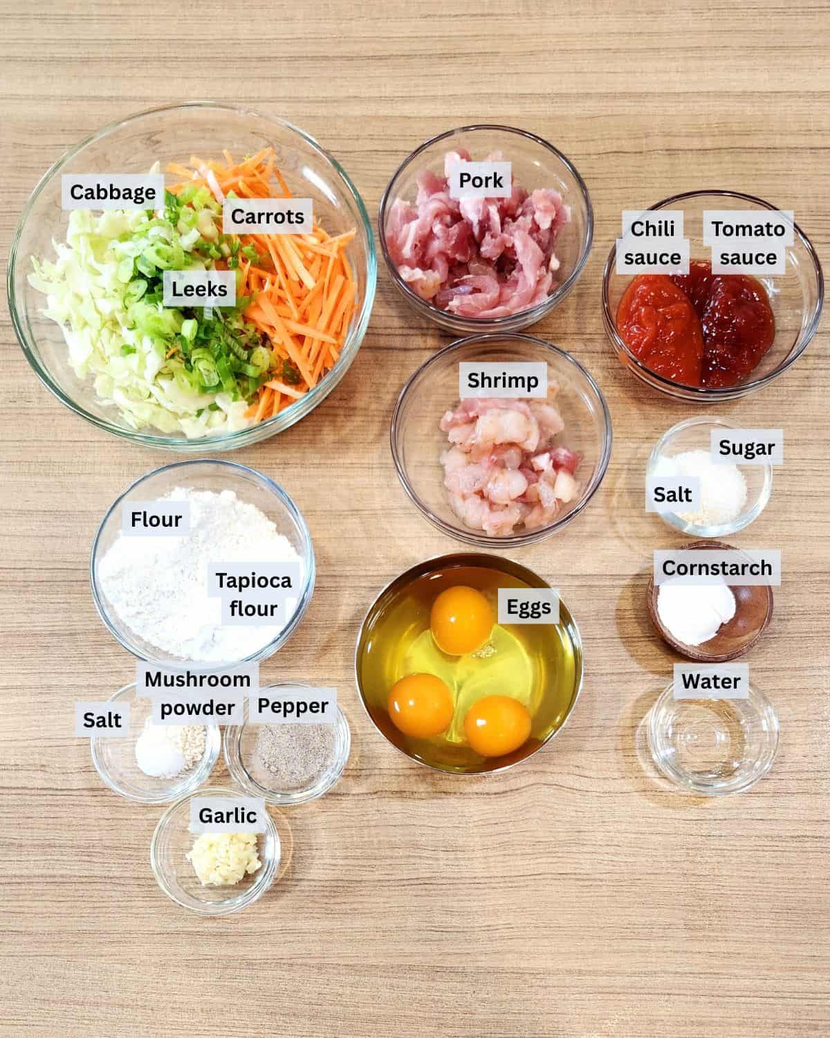 Pork and shrimp egg foo young ingredients with labels.