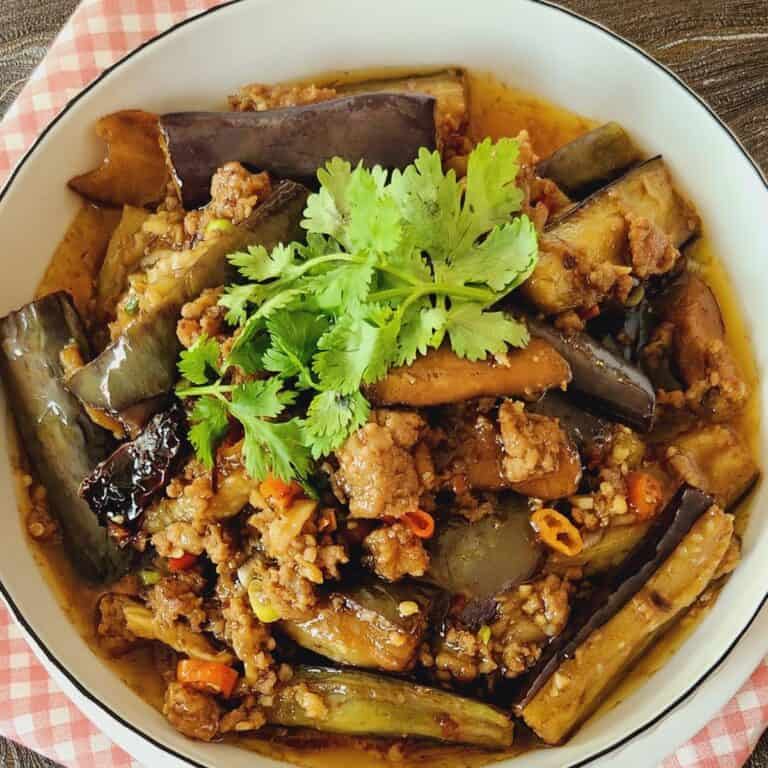 A plate of Chinese eggplant stir fry with ground pork.