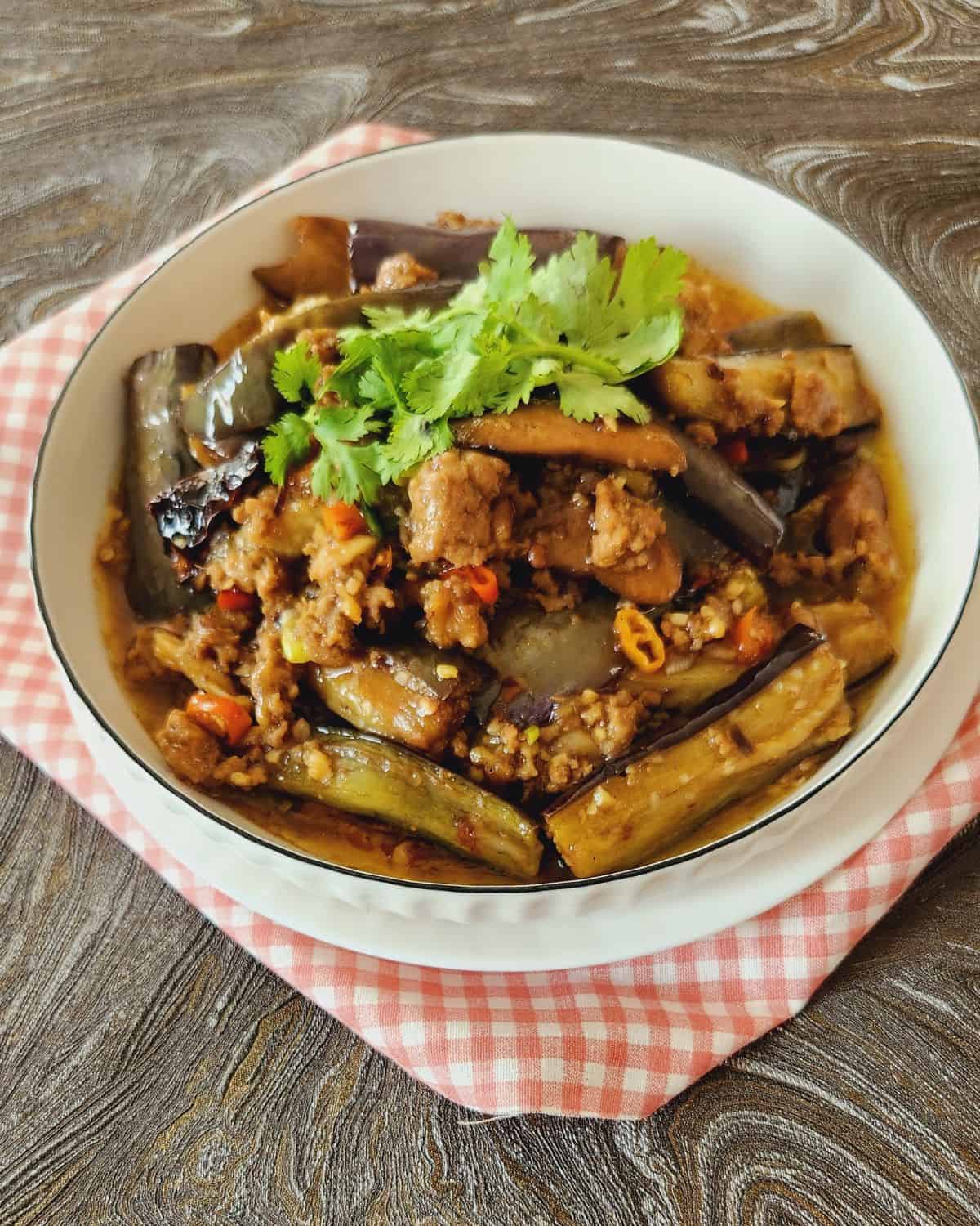 A plate of Chinese eggplant stir fry with ground pork.