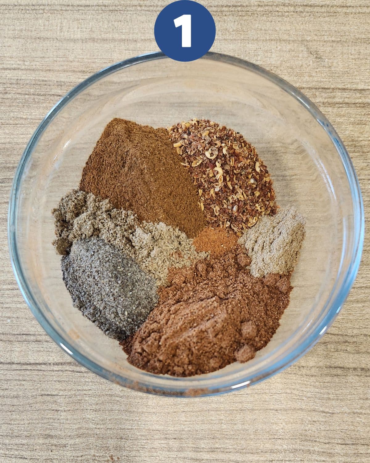 Combining all the ingredients in Chinese five spice powder into a bowl.