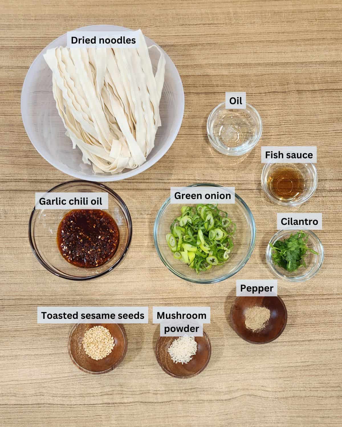 Garlic chili oil noodles ingredients with labels.