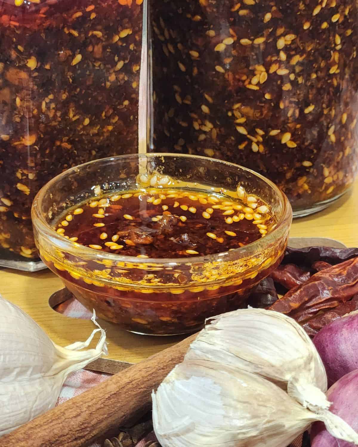 A small sauce bowl filled with garlic chili oi.