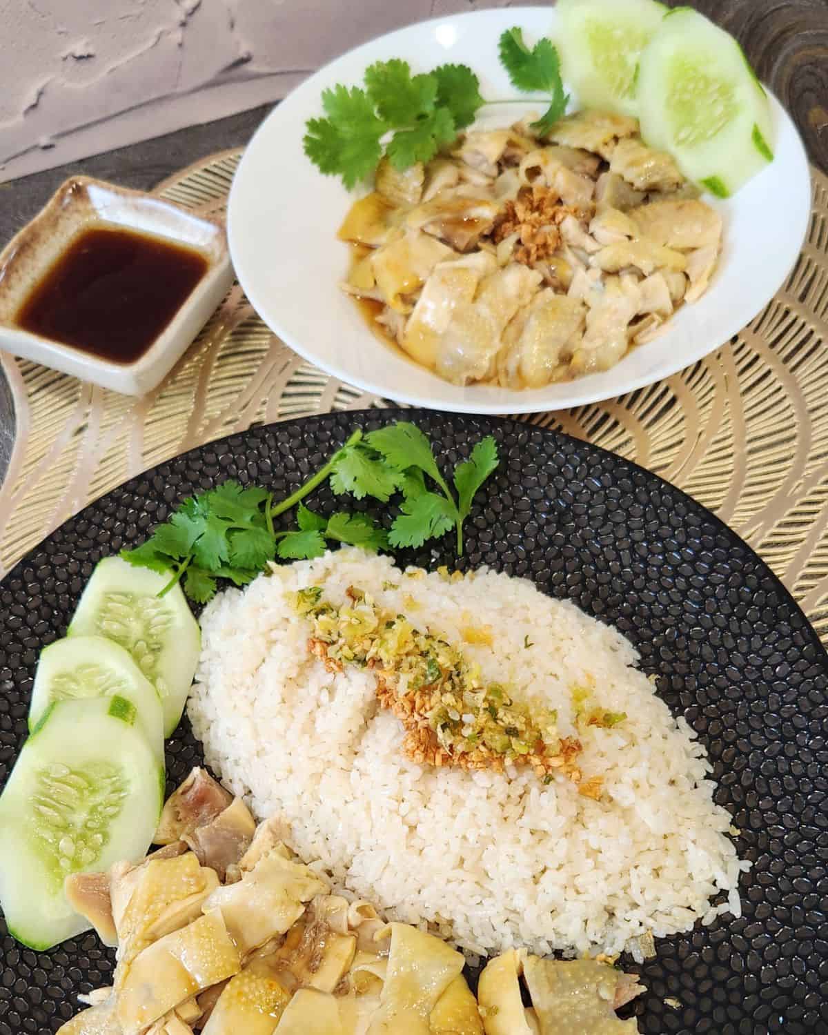 Hainanese chicken served with chicken rice and soy sauce mixture.