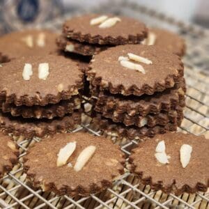Stacks of Dutch speculaas cookies on a cooling rack.