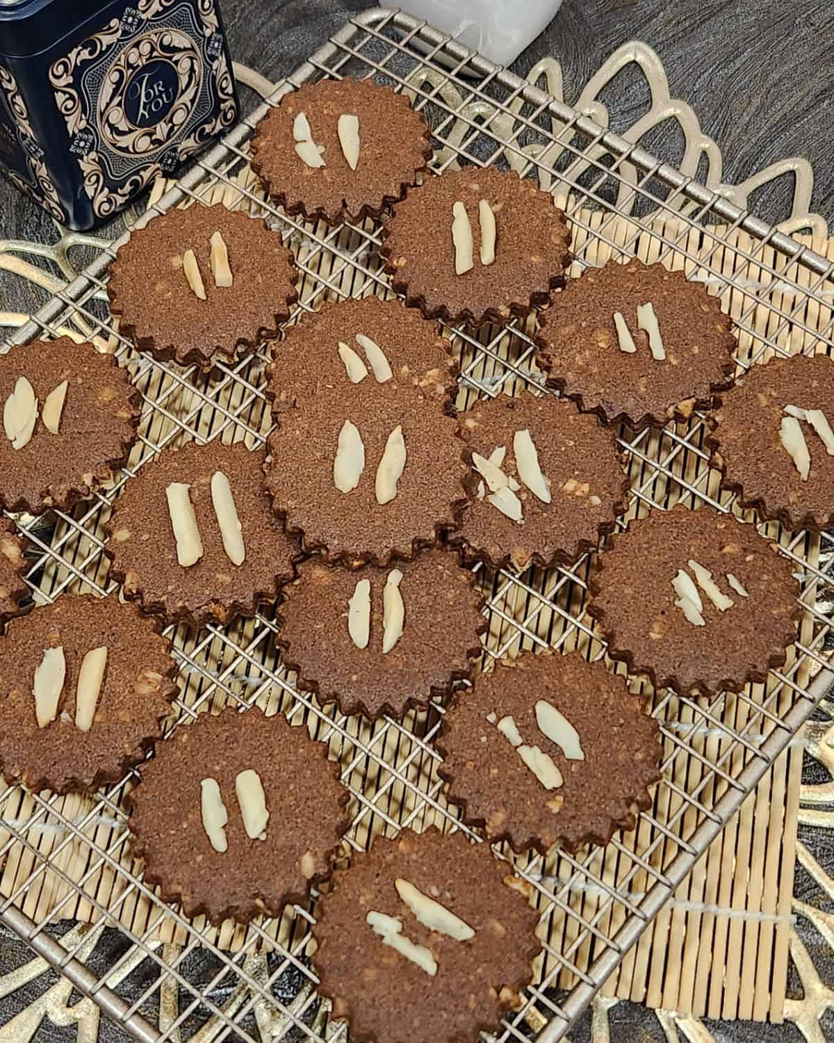 Several Dutch speculaas cookies on a cooling rack.