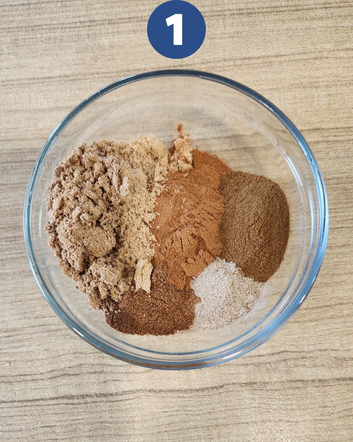 Process photo of mixing the speculaas spice mix in a bowl.