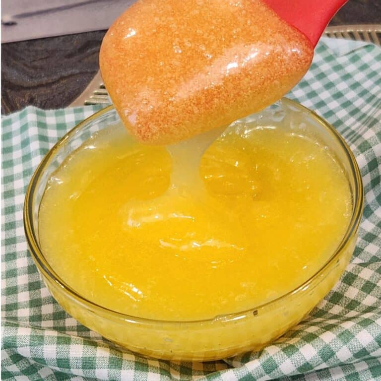 A bowl of Taiwanese sweet mayonnaise with a small spatula spooning the mayonnaise.