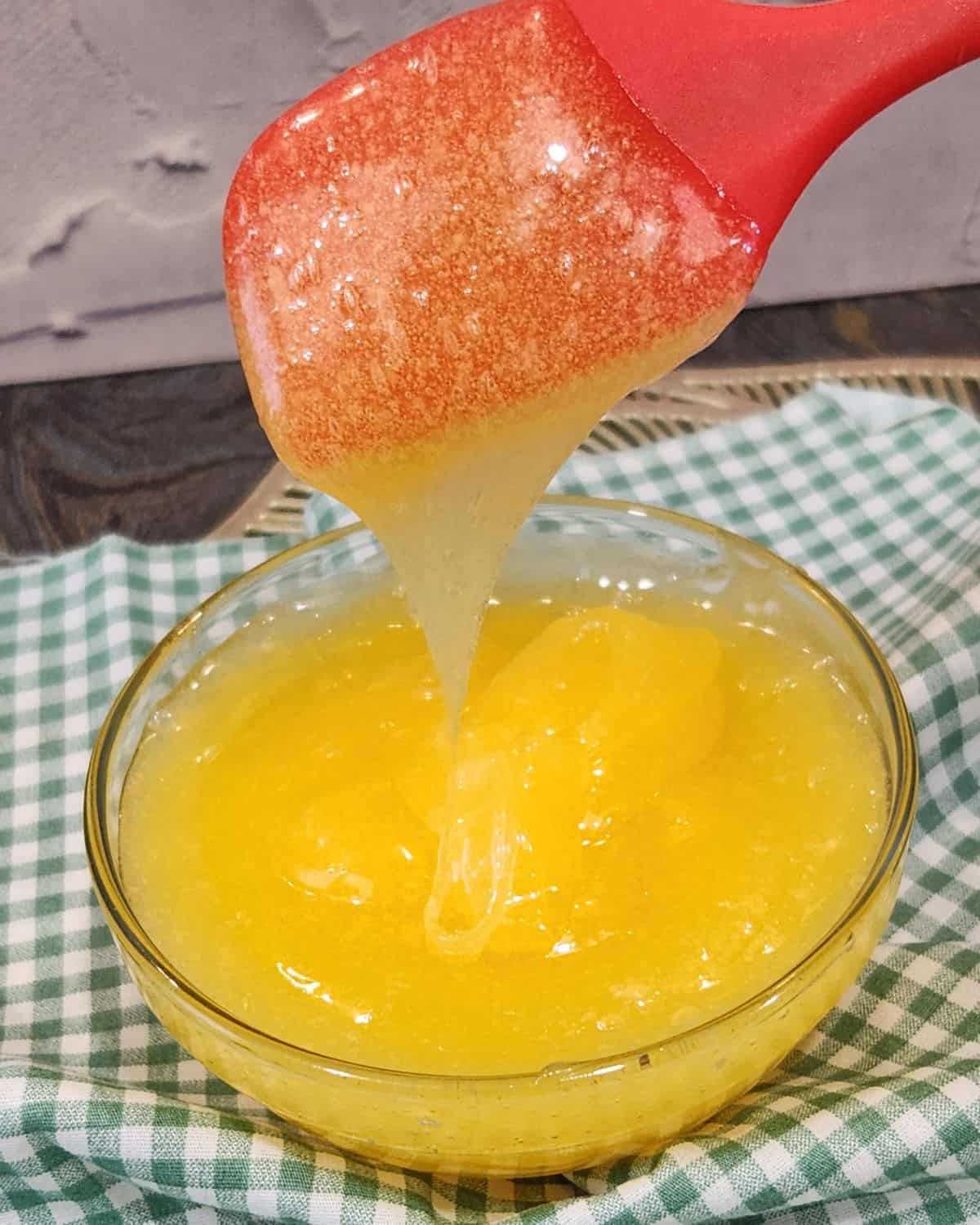 A bowl of Taiwanese sweet mayonnaise with a small spatula spooning the mayonnaise.