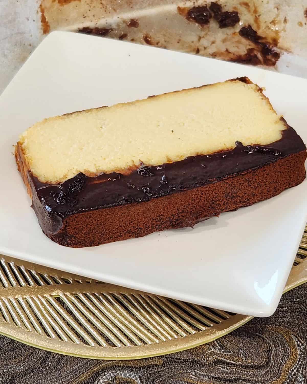 A slice of creamy iceberg cheesecake on a white plate.