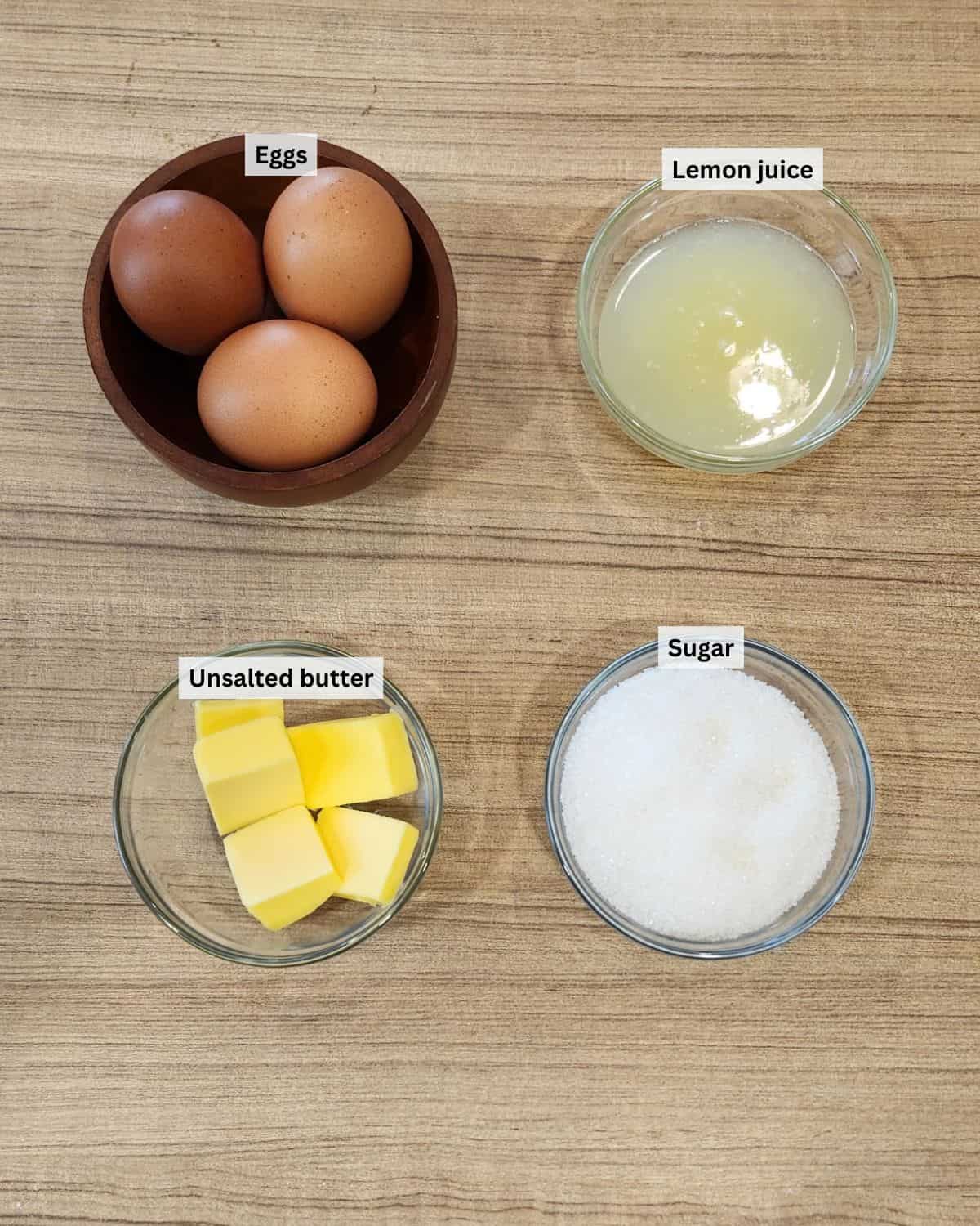 Lemon curd ingredients with labels.