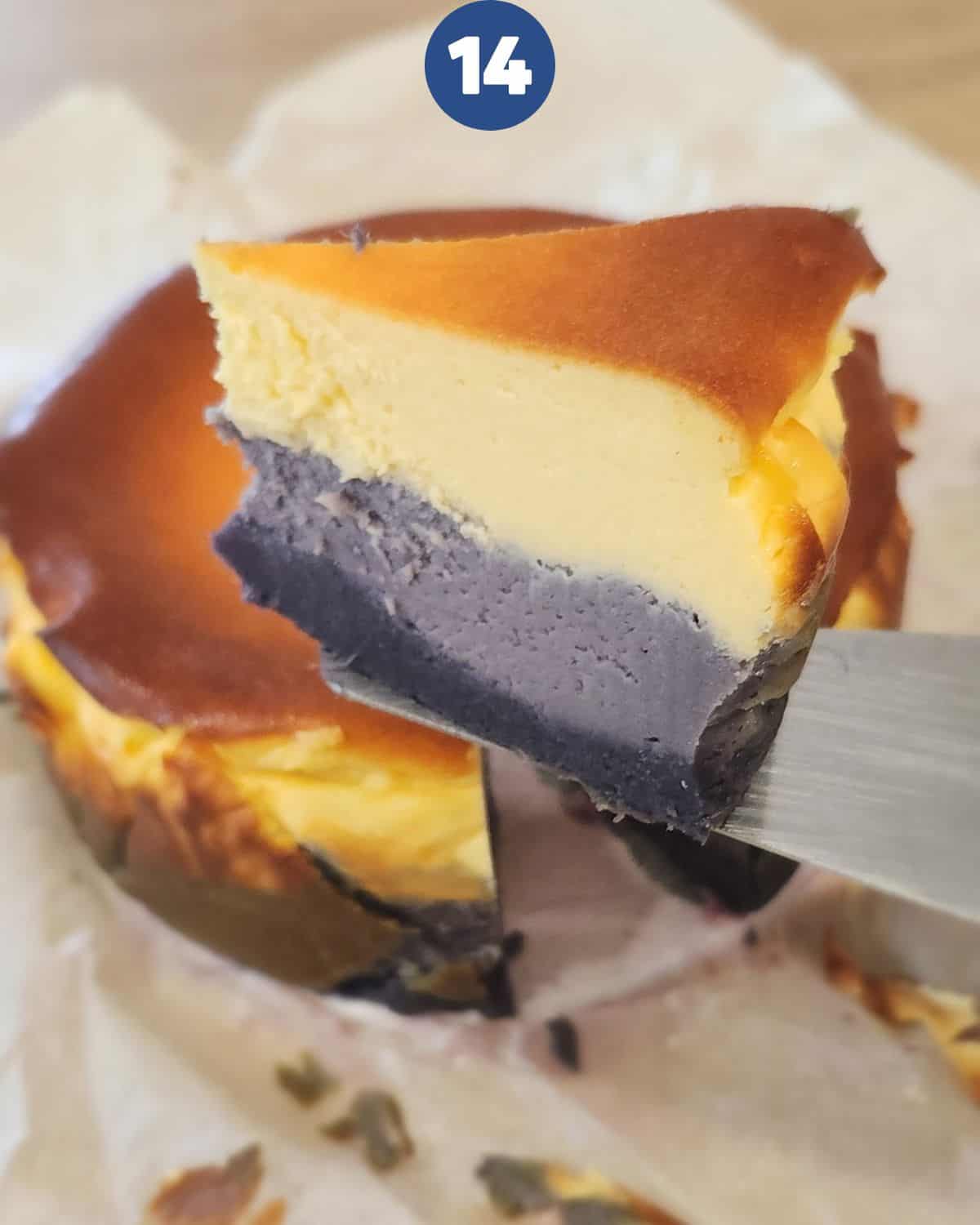 A slice of ube cheesecake being cut after it has cooled down.