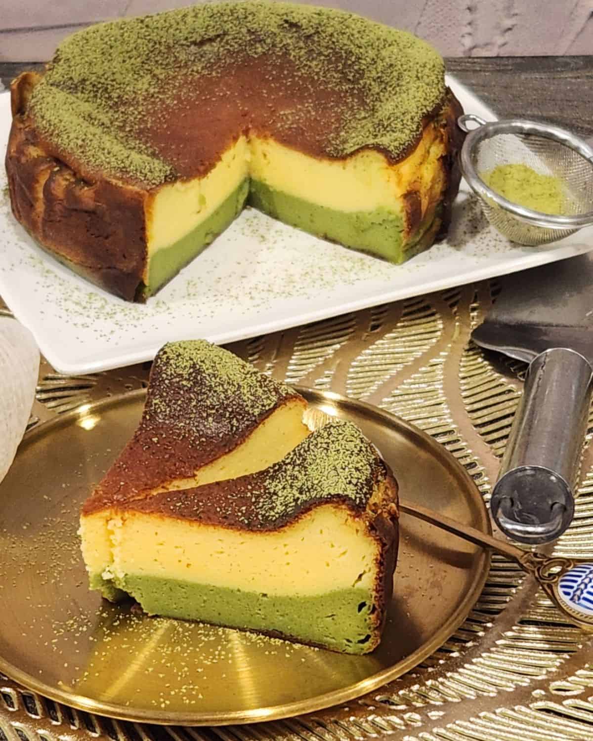 Two slices of matcha cheesecake on a golden plate.